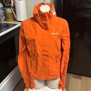 Bench NWT M (S) orange weather zipper pockets hidden hood rain jacket